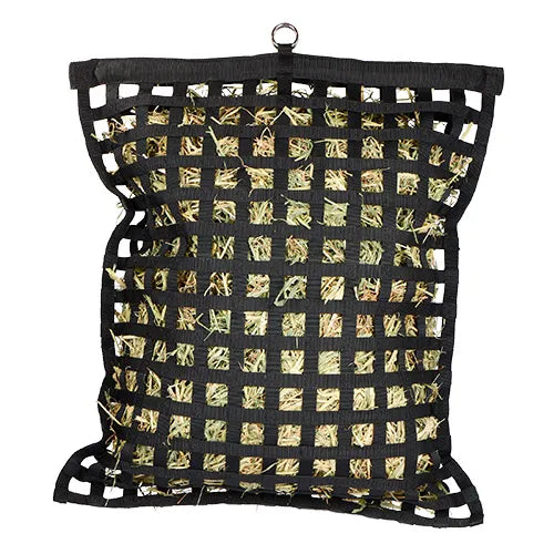 Black mesh bag filled with hay on a white background